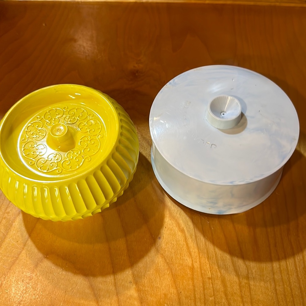 Two vintage powder dusting containers
